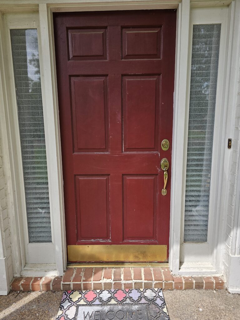 Front red door with Schlage locks before rekeying