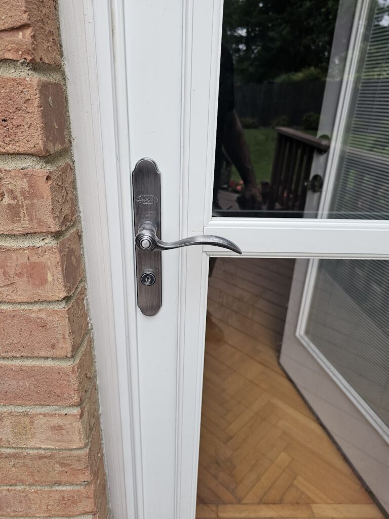 Storm door handle and lock measured for replacement and rekeying in Cordova
