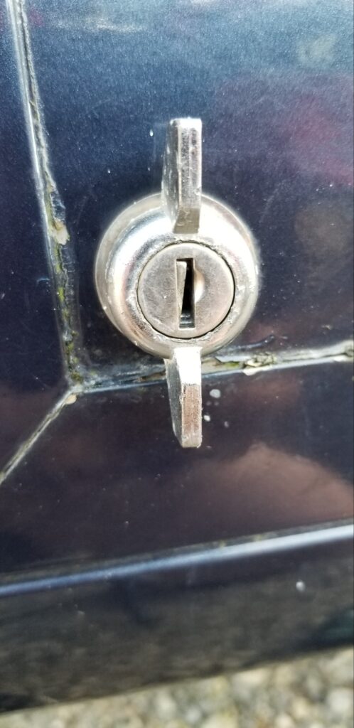 RV storage compartment lock needing rekeying or full replacement for security.