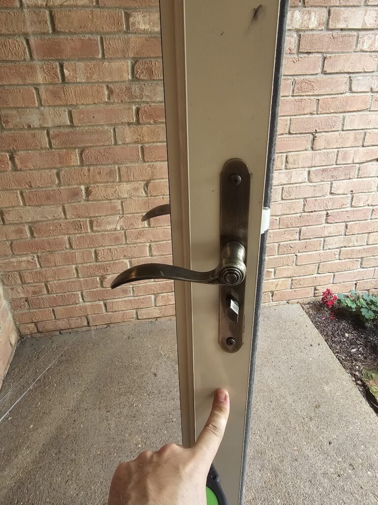 Interior view of sliding storm door lock realignment after repair in Cordova