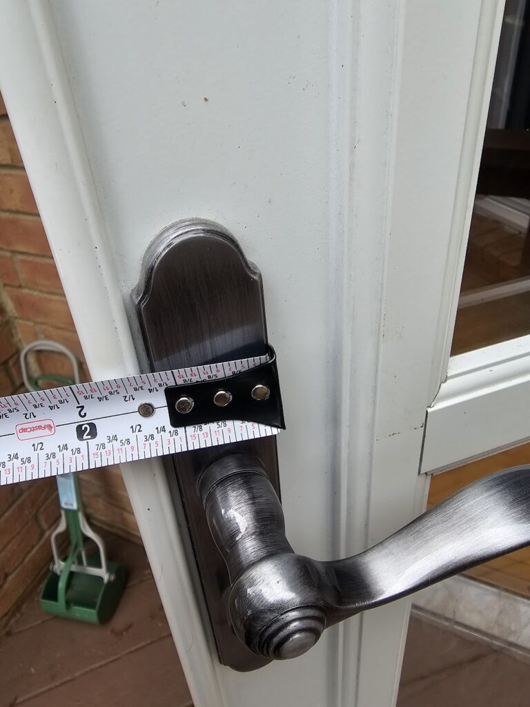 Front storm door latch and frame repaired for secure locking in Cordova, TN