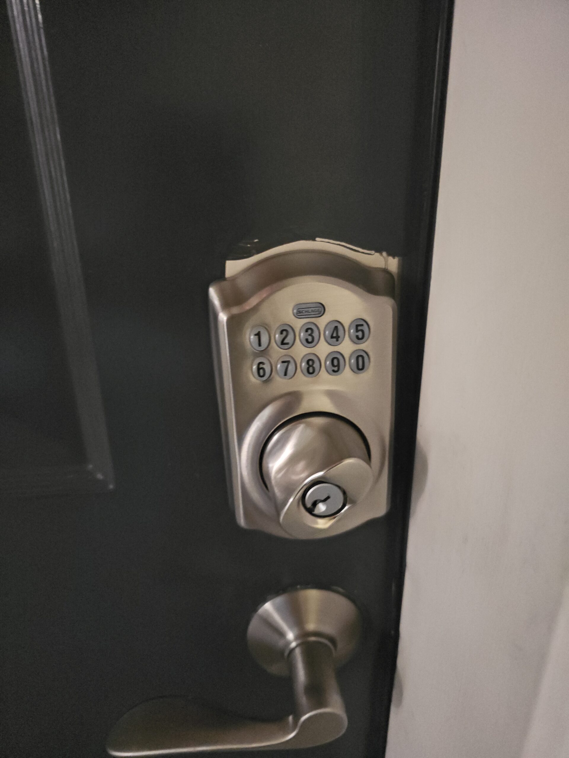 Schlage keypad smart deadbolt newly installed on a black front door